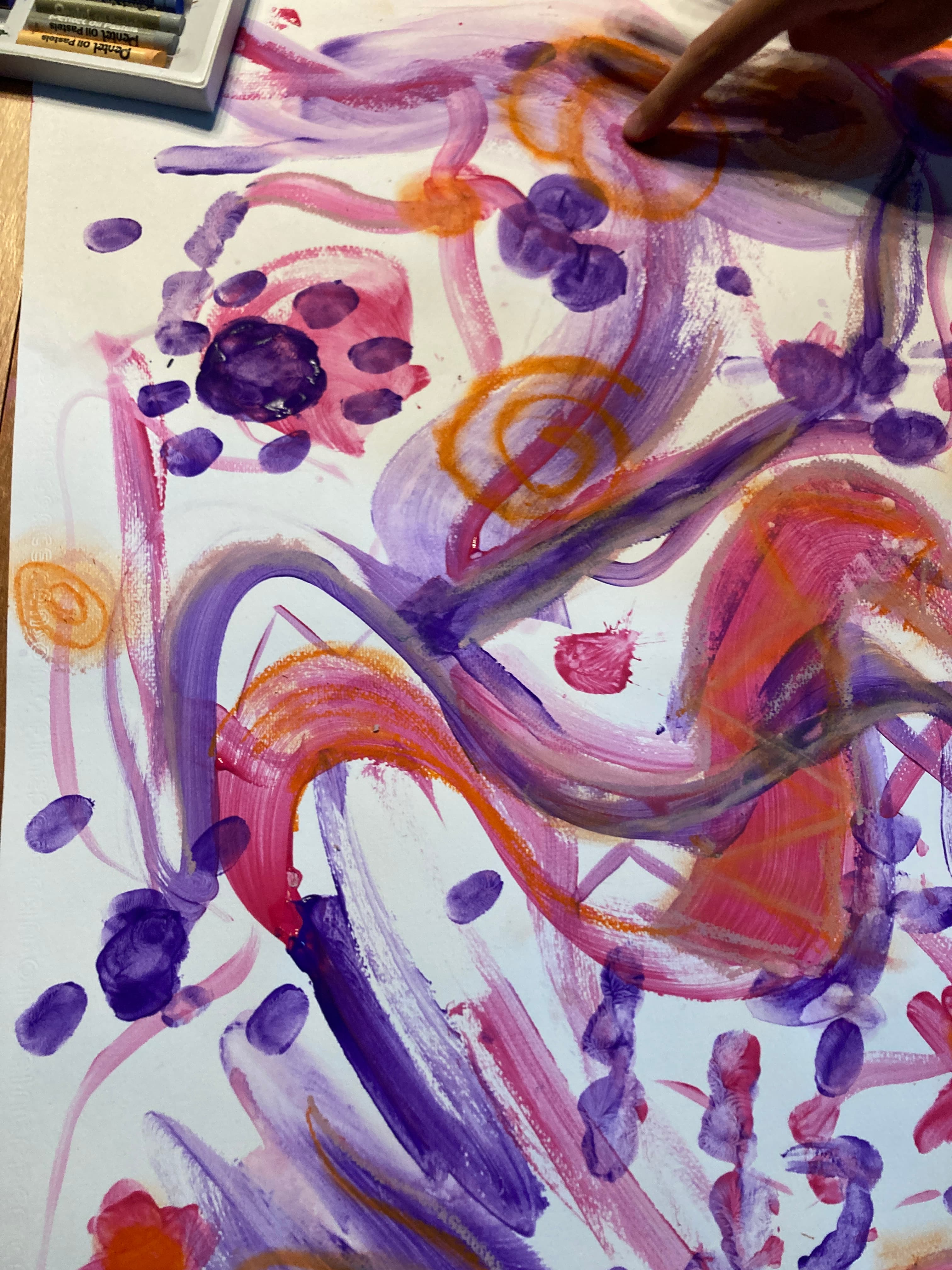 Close-up abstract purple, pink, and orange painting