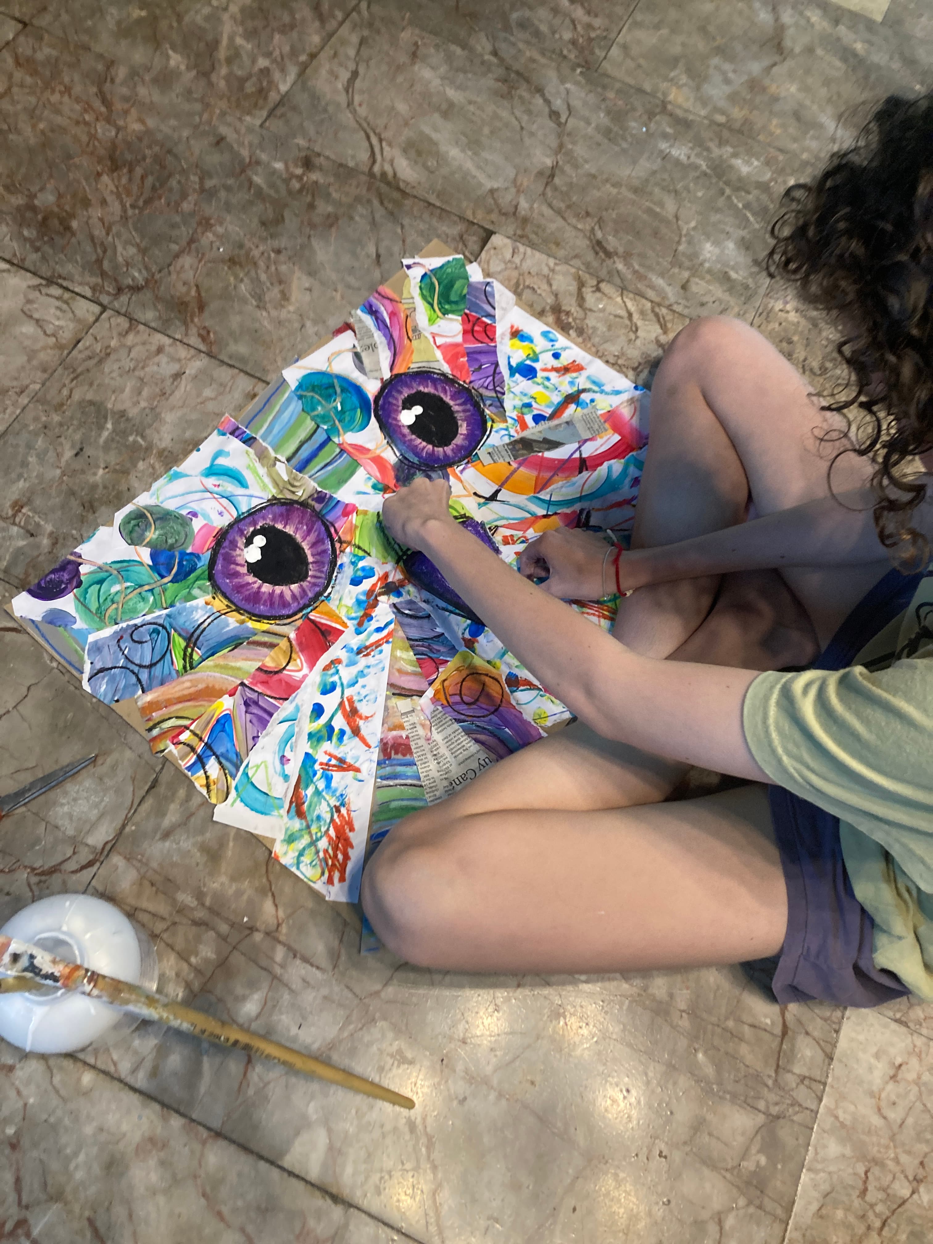 Child working on colourful owl painting