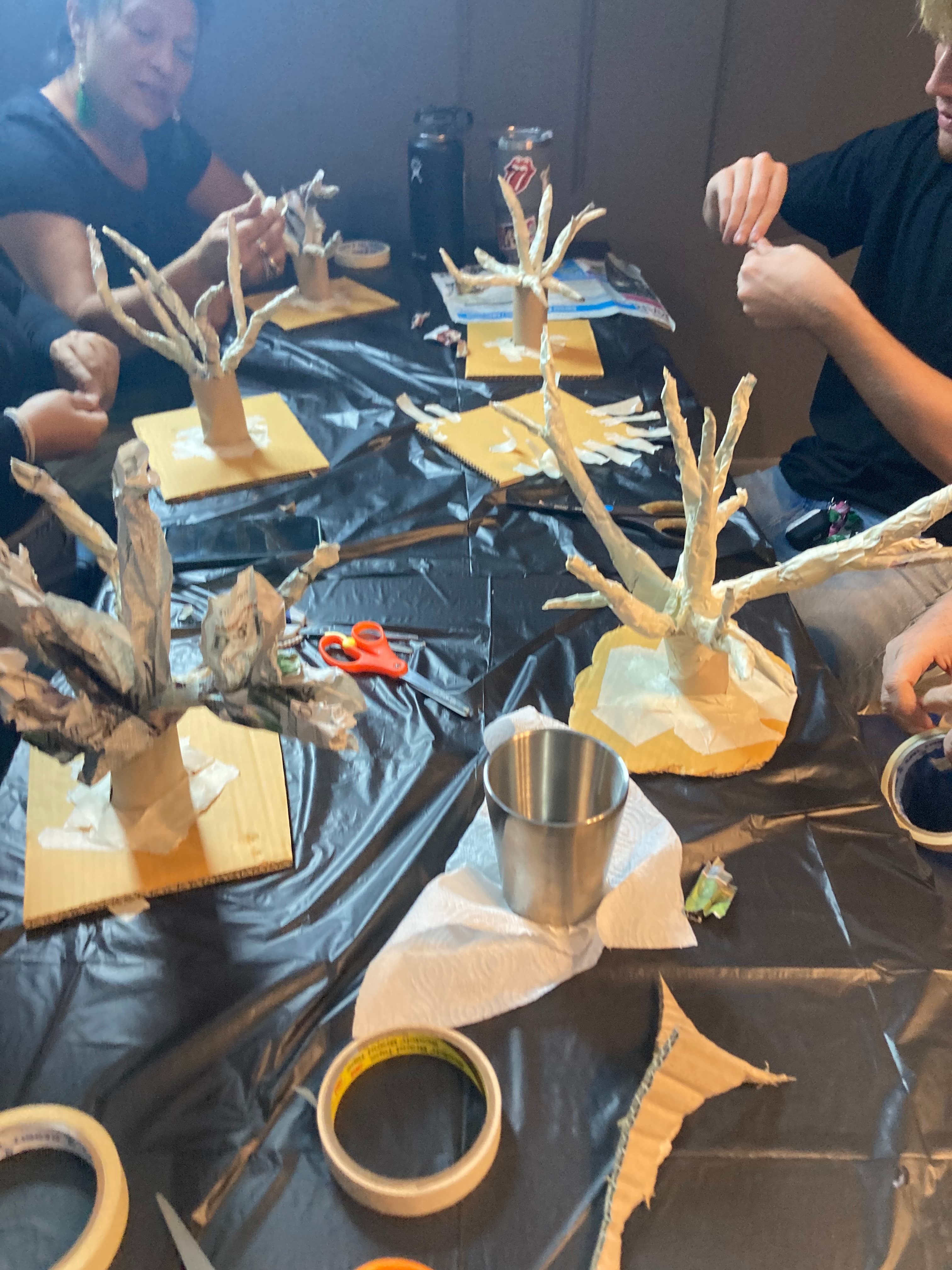 Paper mache trees arranged on table