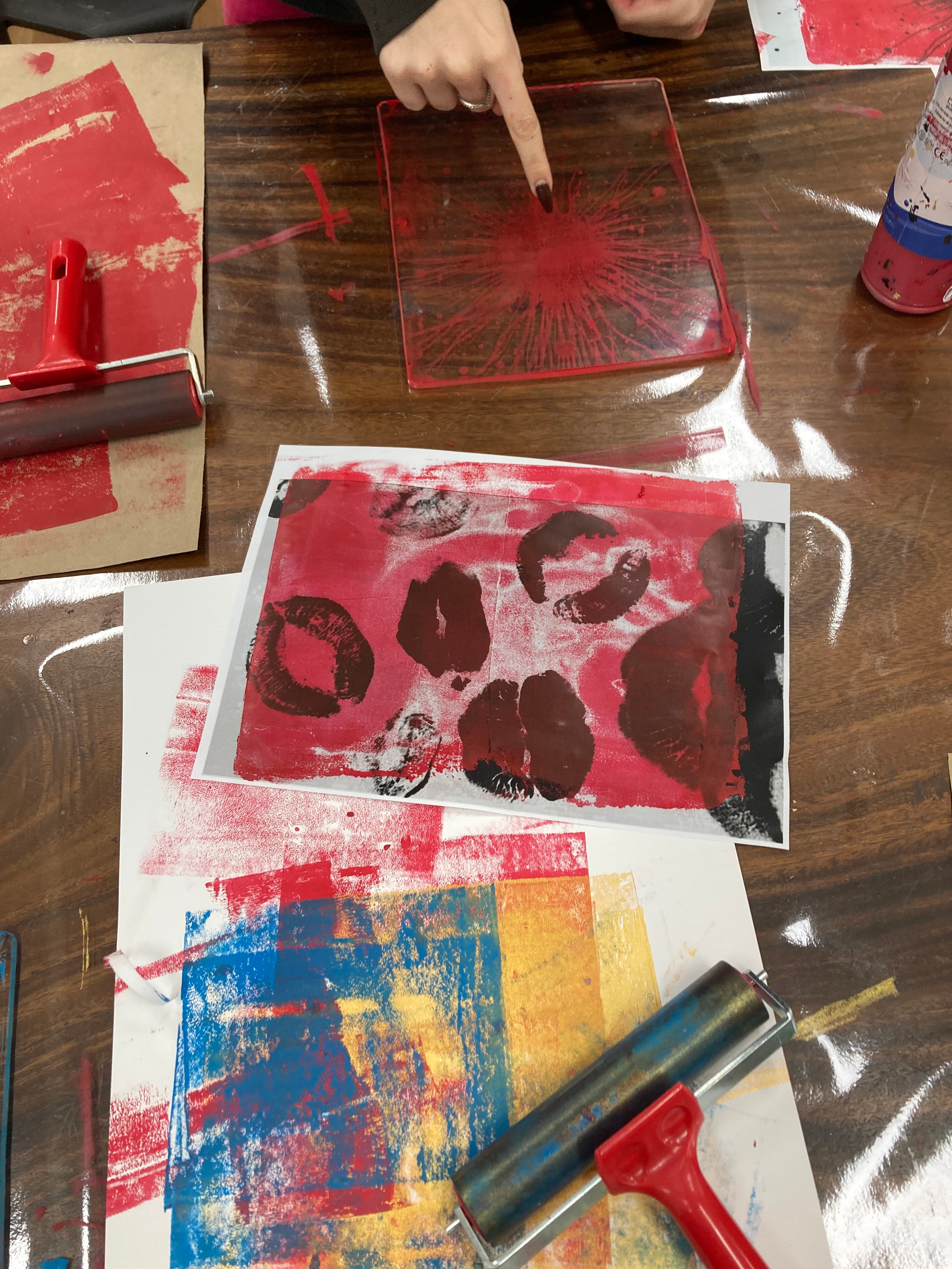 Close-up of red prints and roller