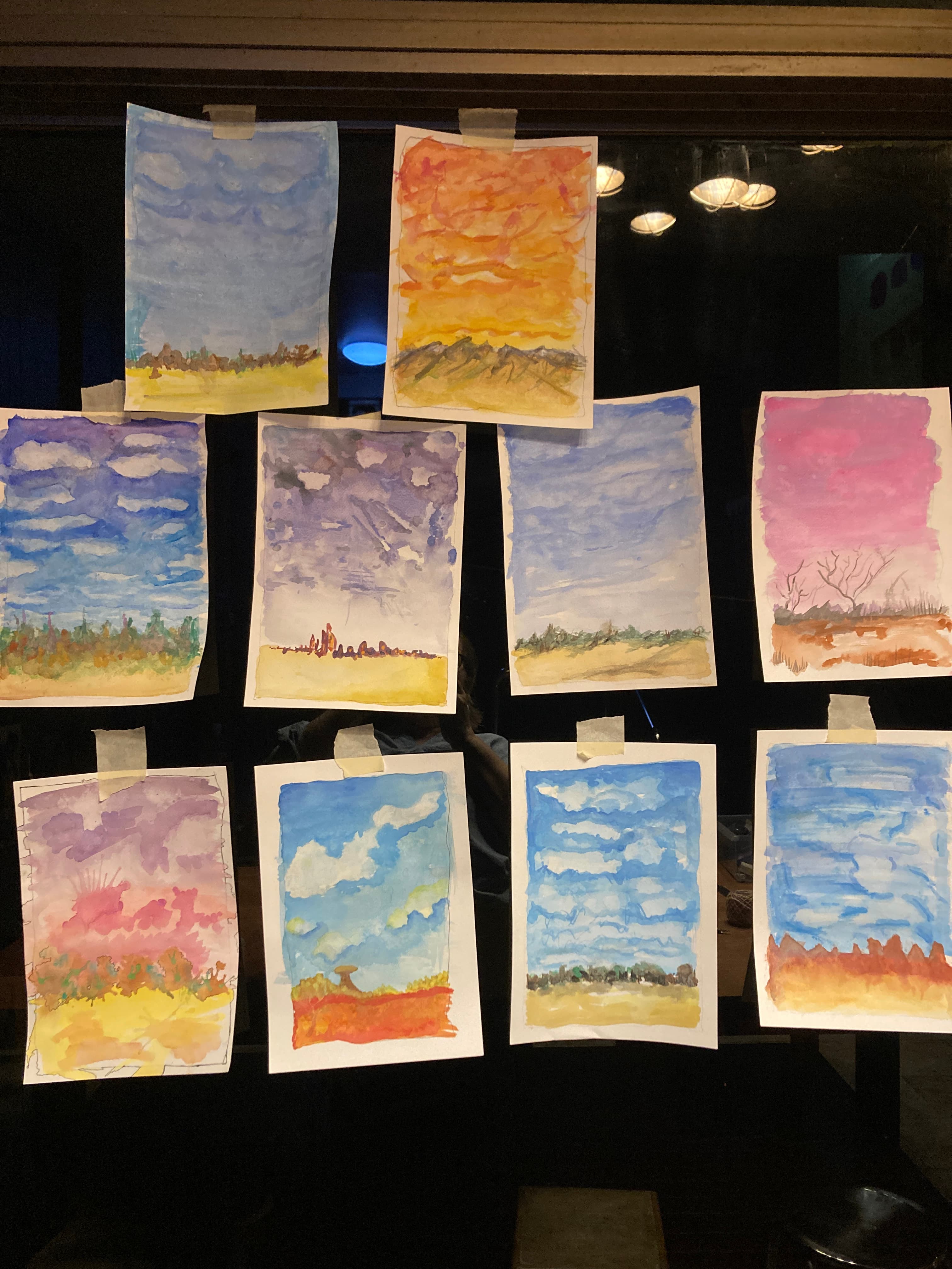 Window full of landscape watercolour paintings